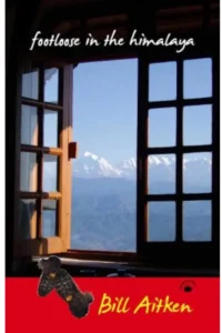 A book cover titled "Footloose in the Himalaya" by Bill Aitken. The cover image features an open window with a view of snow-capped mountains and a clear blue sky.