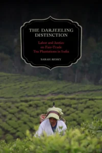 A book cover titled "The Darjeeling Distinction: Labor and Justice on Fair-Trade Tea Plantations in India" by Sarah Besky. The cover features a vibrant illustration of a tea plantation with workers harvesting tea leaves.