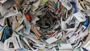 Chaotic pile of books and papers for Book blogs